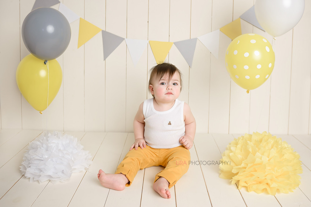 one year old boy with birthday decorations